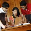 International students look at a tablet in the Illini Union South Lounge.